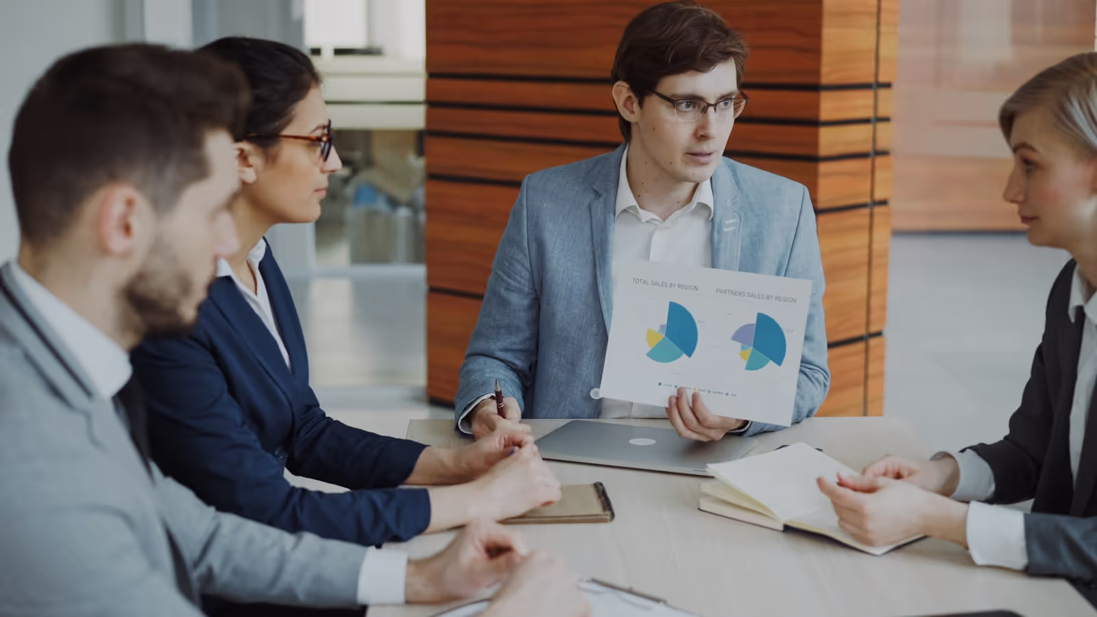 A diverse group of executives engaged in a strategic discussion.