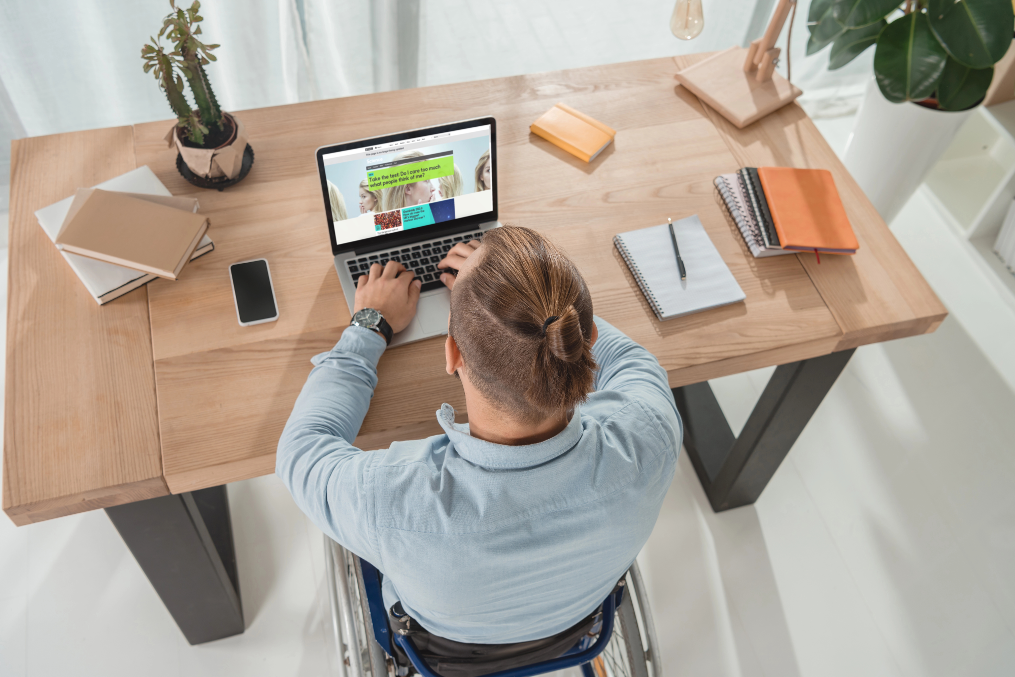 Disabled man using laptop
