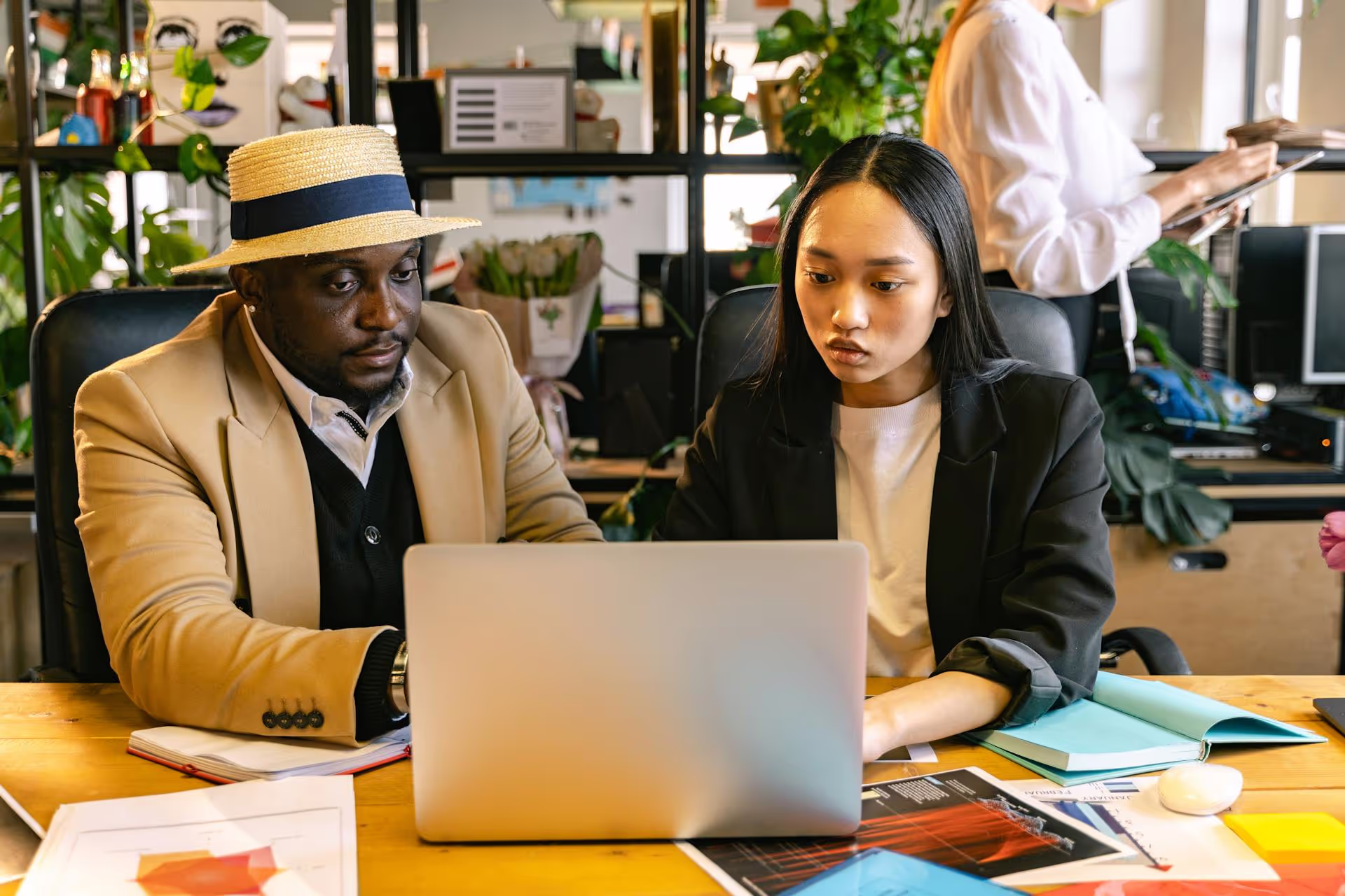 Employees Using a Laptop in the Office
