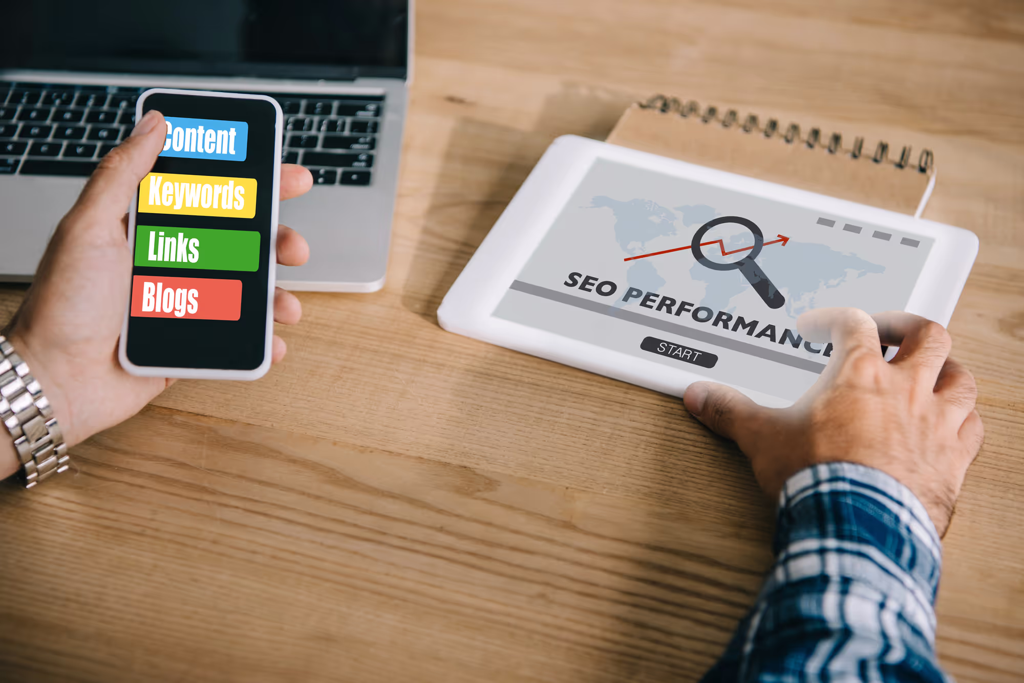 Cropped shot of professional developer using different gadgets with SEO performance