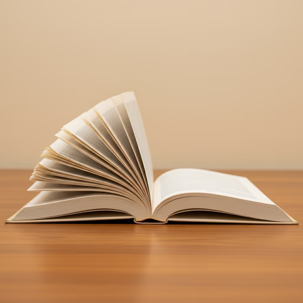 An open book with pages more worn on one side than the other in warm overhead light, featured image representing the story a child has returned to again and again