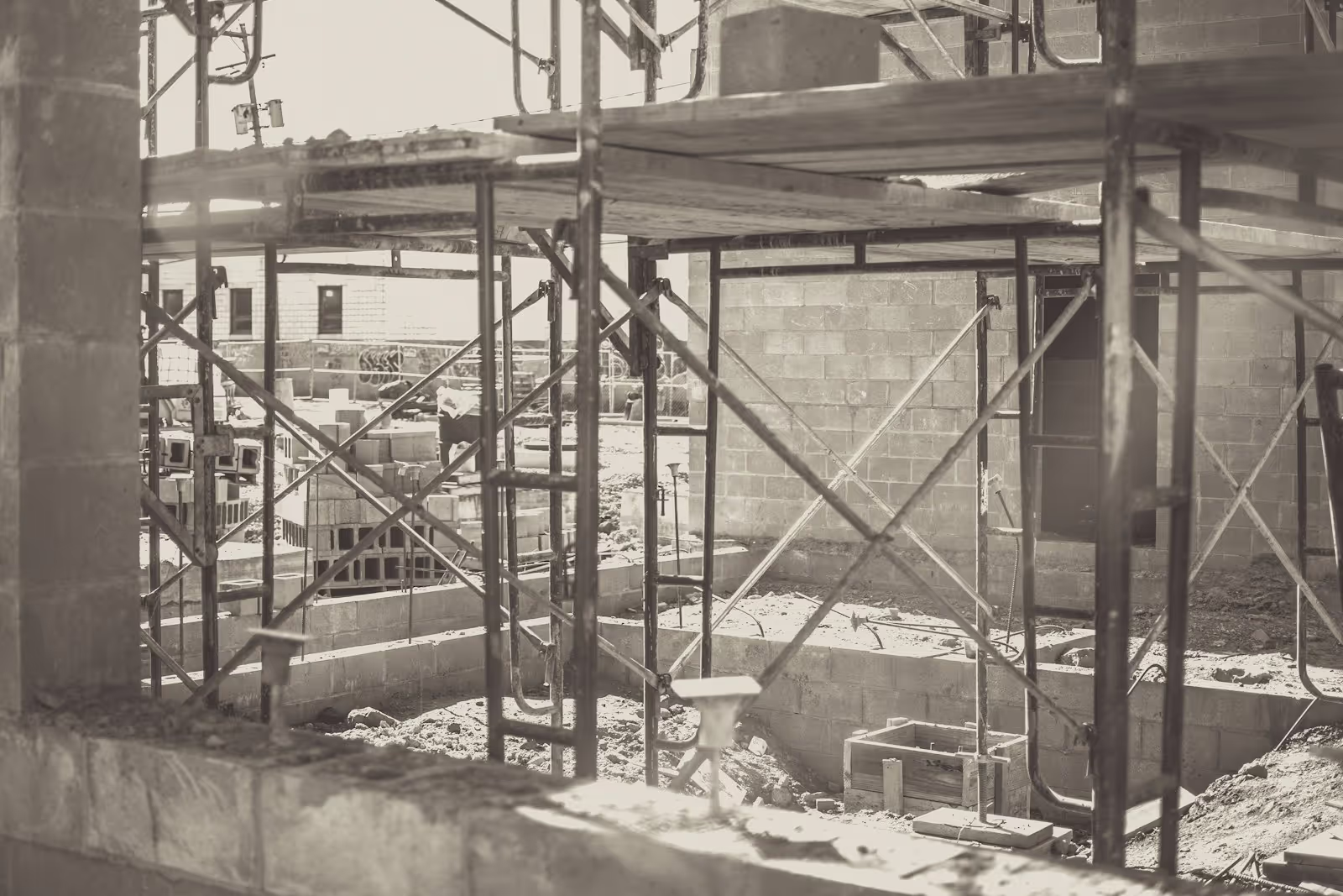 A team of Doma & Benri Builders collaborating digitally on project plans and schedules.