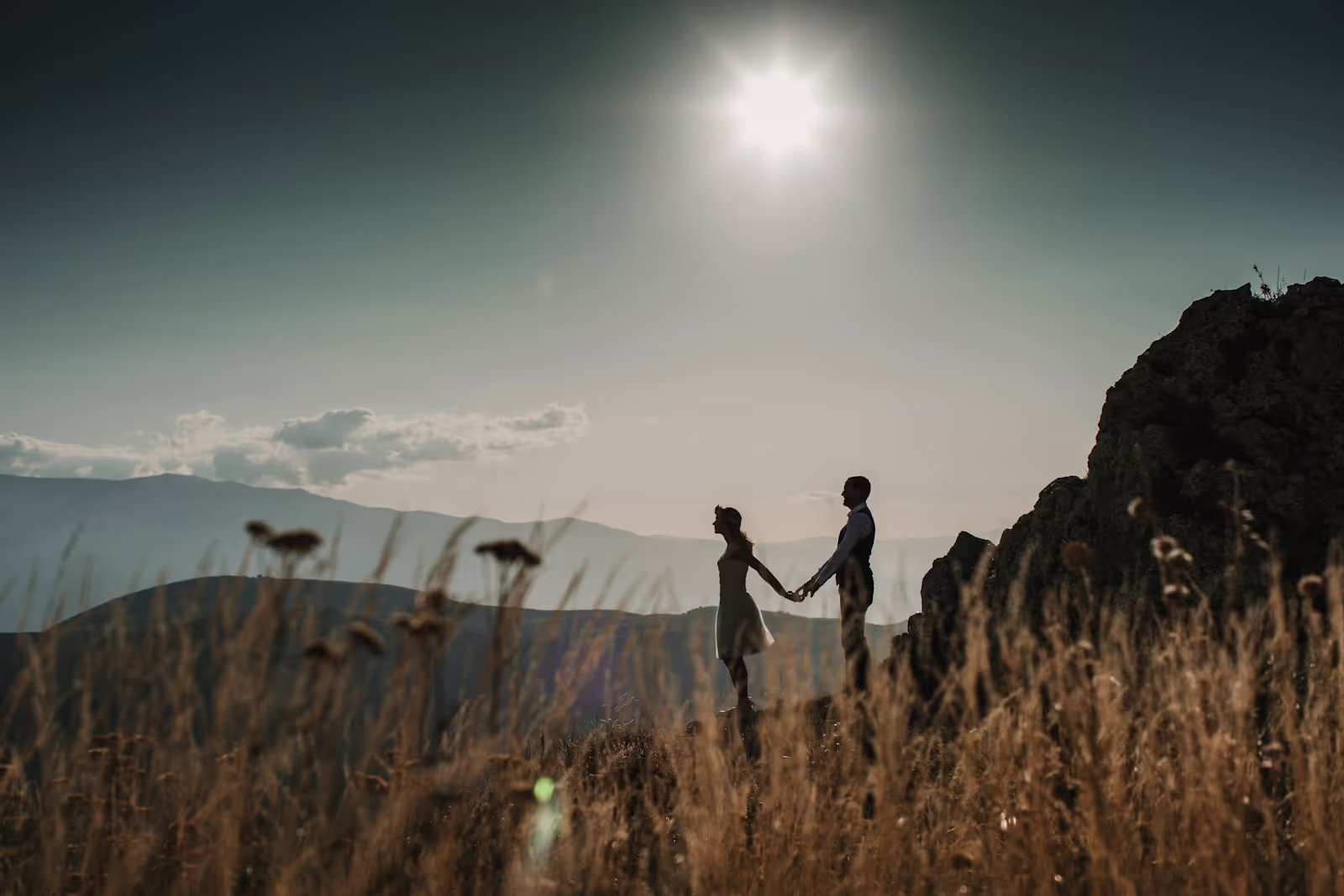 Elopement couple holding hands in scenic setting