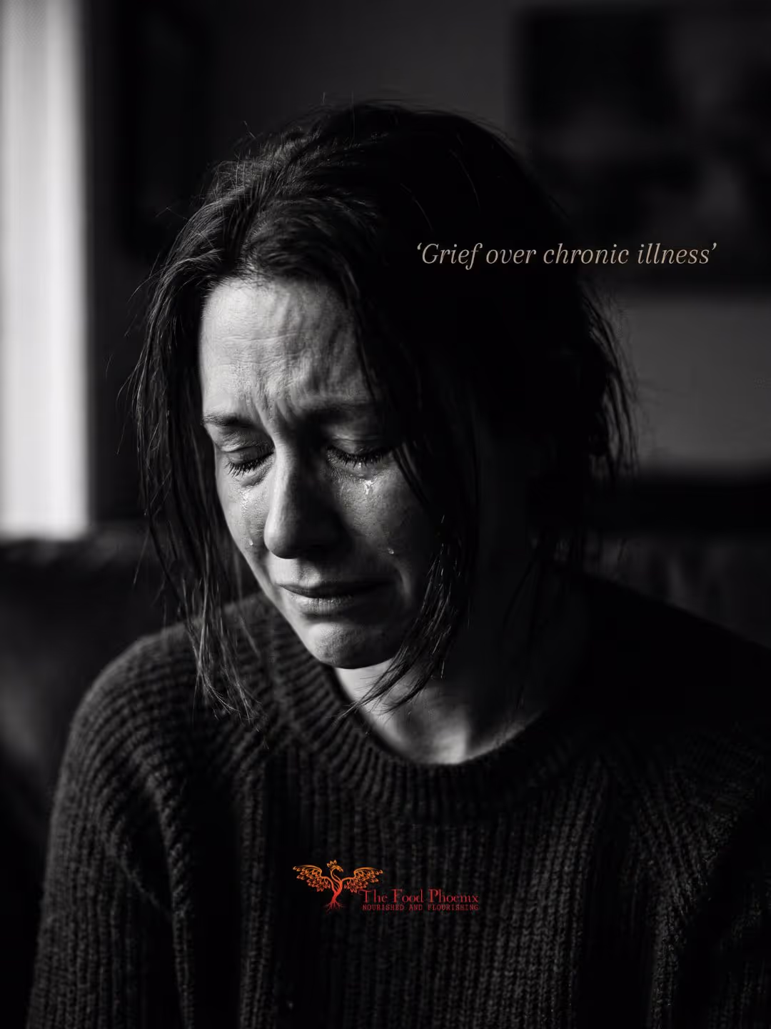Black-and-white close-up of a person crying with eyes closed and tears on their cheeks, wearing a dark knit sweater; overlay text reads 'Grief over chronic illness' with a small phoenix logo and 'The Food Phoenix' at the bottom.
