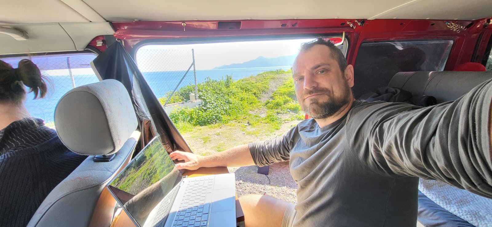 Konrad working on his laptop from the VW T4 Konrad working on his laptop from the VW T4