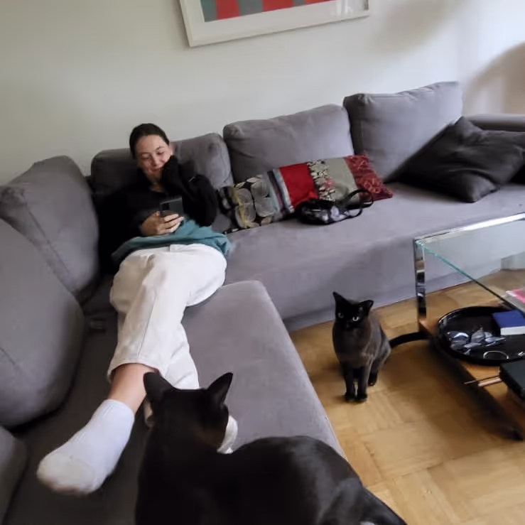Original photo of Caro sitting at a house sit with cats around