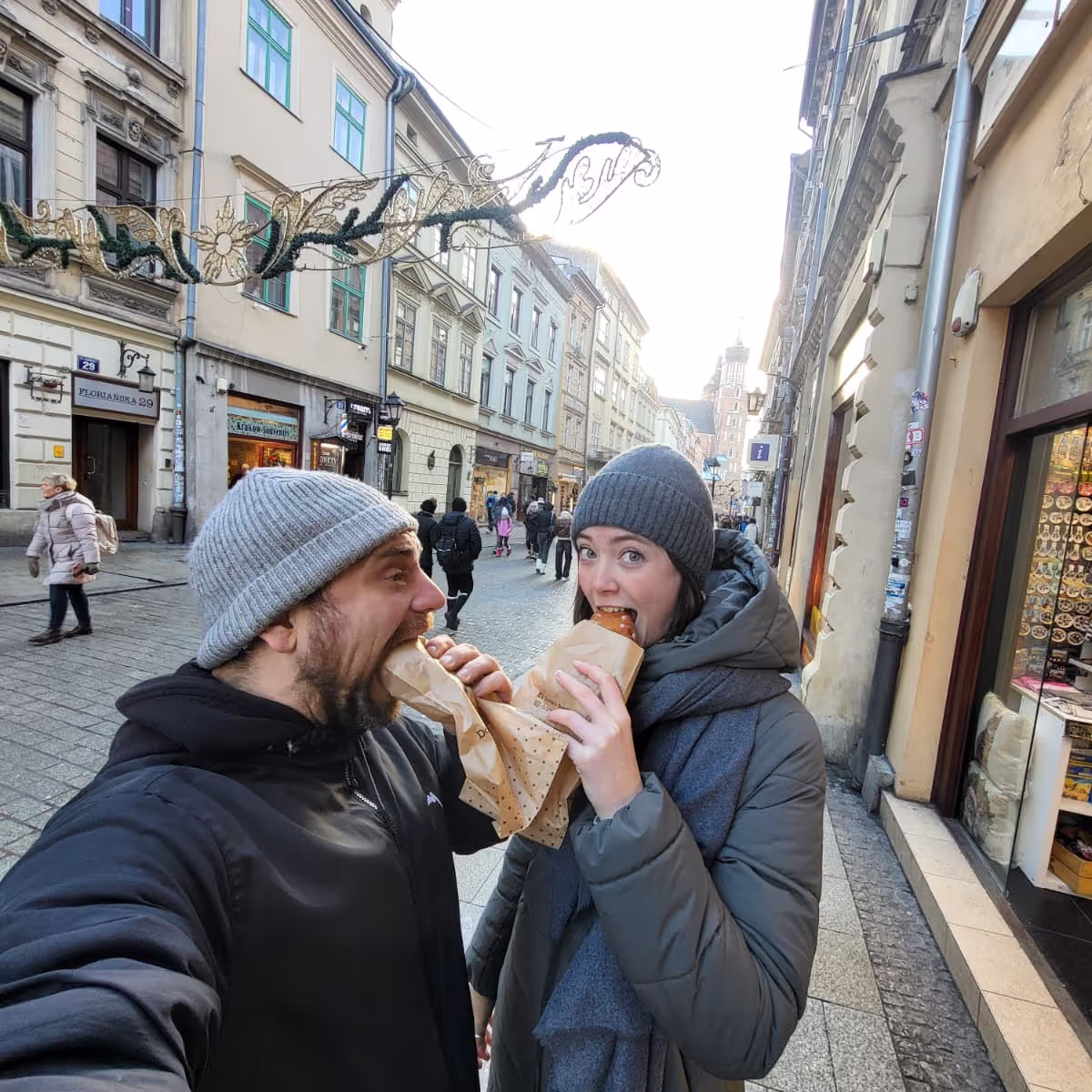 Konrad and Caro eating street food in Krakow
