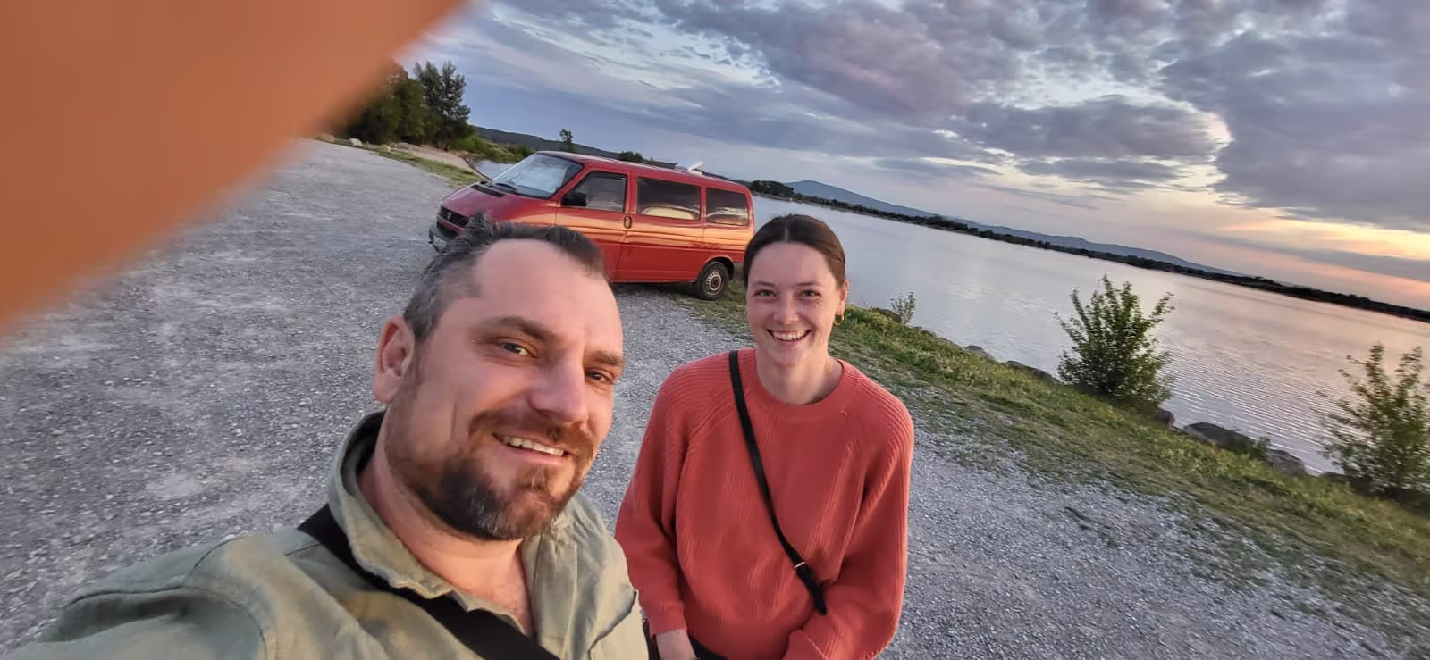 Konrad and Caro campervanning by a lake in France