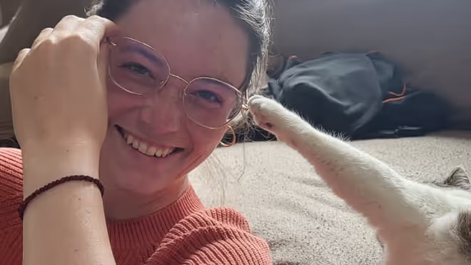 A cat during out house sit in France, trying to pull of Caro's classes A cat during out house sit in France, trying to pull of Caro's classes