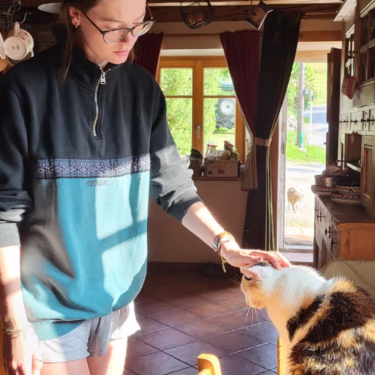 Caro Petting a cat during out house sit in Lullin France