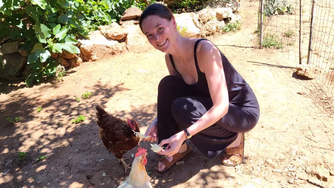 Caro feeding the chickens 