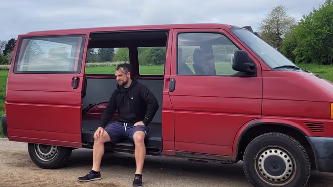 Konrad in our newly purchased VW T4 van that we converted into a campervan