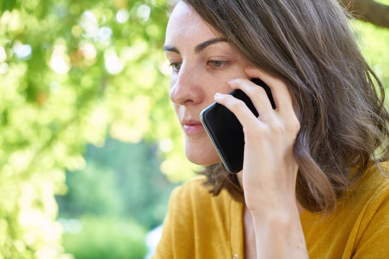 A person calling and waiting for someone to respond