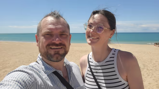 Konrad and Caro on a beach in Portugal
