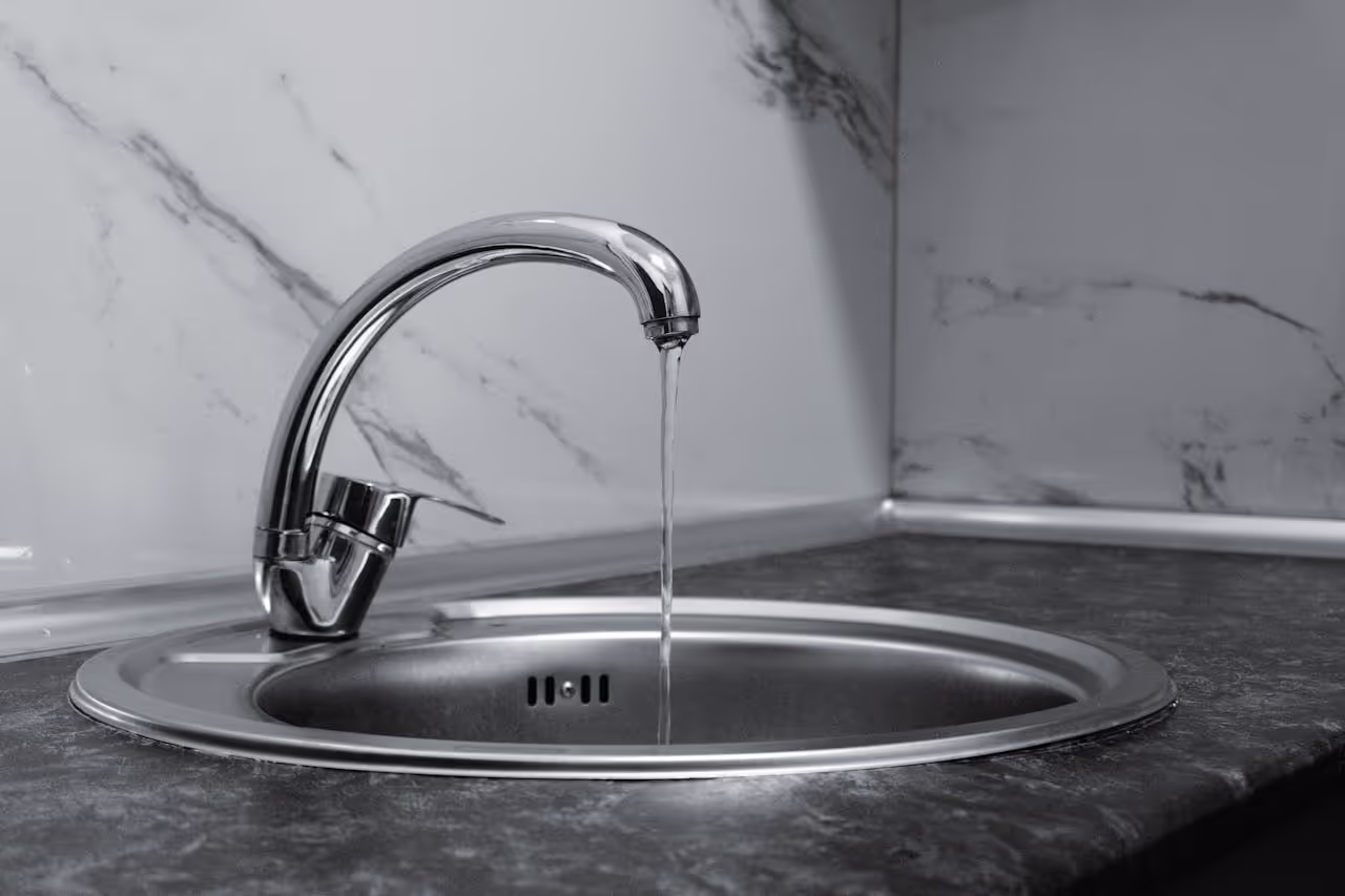Water running from the tap at a new house sit Water running from the tap at a new house sit