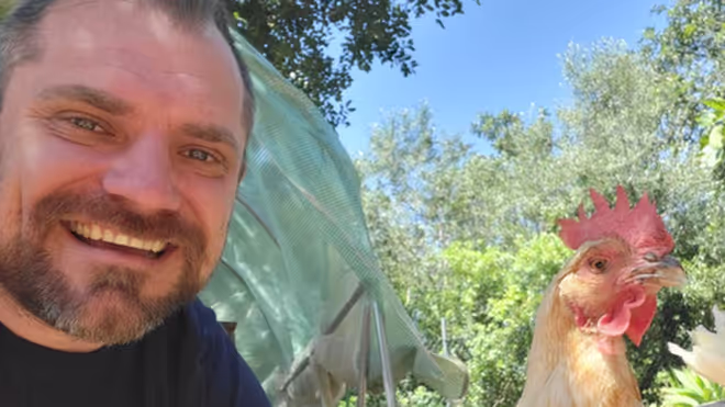Konrad with a chicken at the house sit in Portugal Konrad with a chicken at the house sit in Portugal