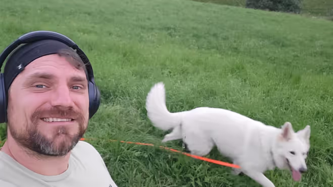 Konrad taking a dog for a walk in Switzerland Konrad taking a dog for a walk in Switzerland