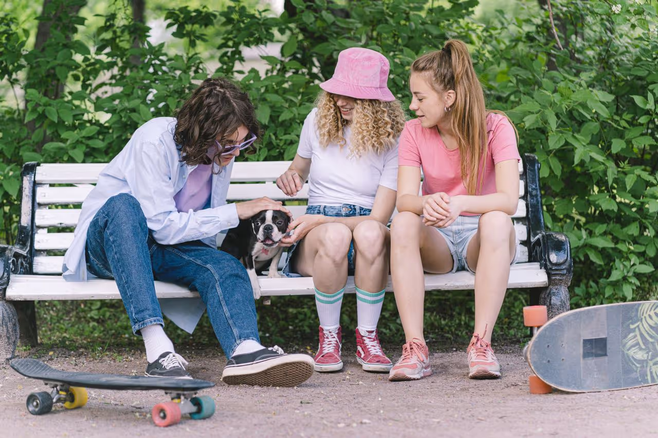 Young adults looking after a dog