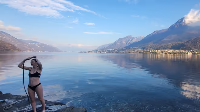 Caro showering at lake Como in winter Caro showering at lake Como in winter