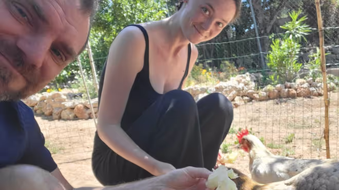 Konrad and Caro feeding the chickens Konrad and Caro feeding the chickens