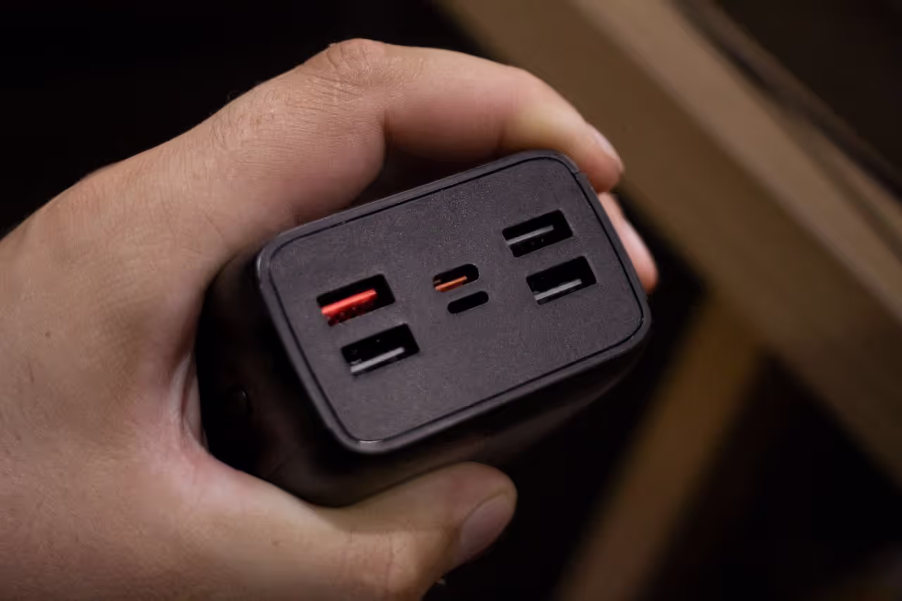 A GaN charger used to charge devices of a house sitter A GaN charger used to charge devices of a house sitter