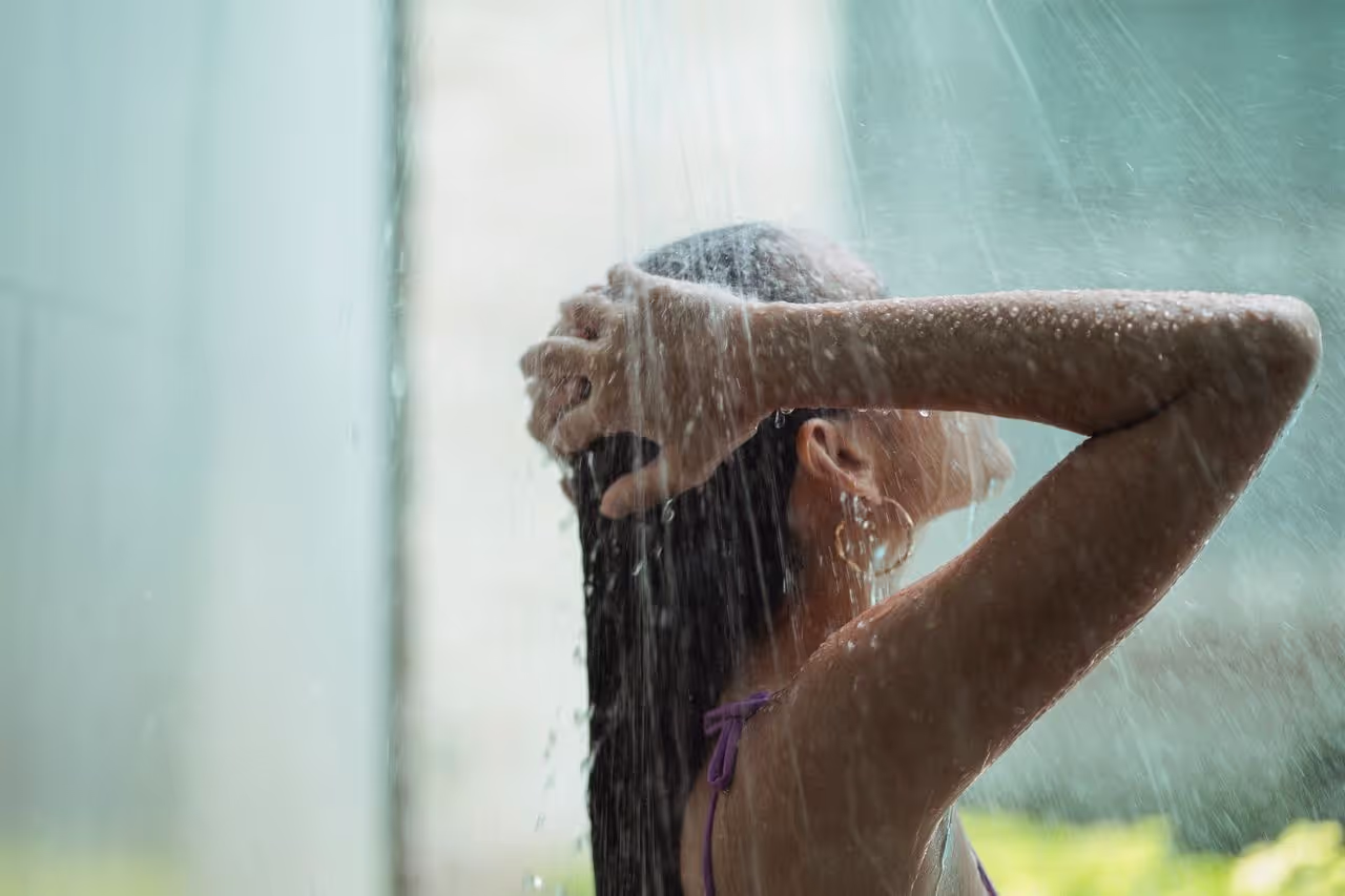 A woman having a shower A woman having a shower