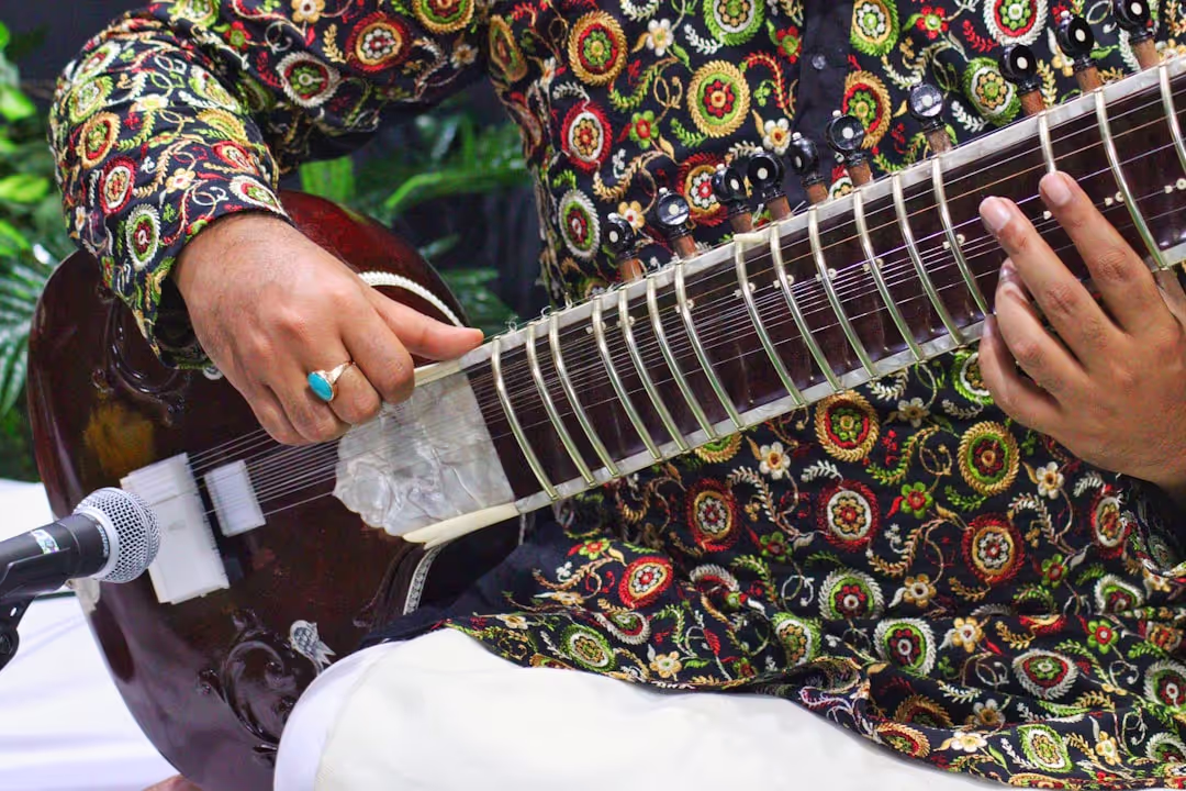 Podcast thumbnail showing traditional Indian musical instruments