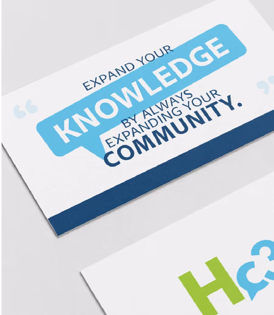 A close-up of two cards. The top card features the quote 'EXPAND YOUR KNOWLEDGE BY ALWAYS EXPANDING YOUR COMMUNITY.' 'KNOWLEDGE' is prominently displayed in white text within a light blue speech bubble, while 'COMMUNITY' is in dark blue text. The card has a dark blue border at the bottom. Below it, a second card is partially visible, showing a green 'H' and part of a blue speech bubble.