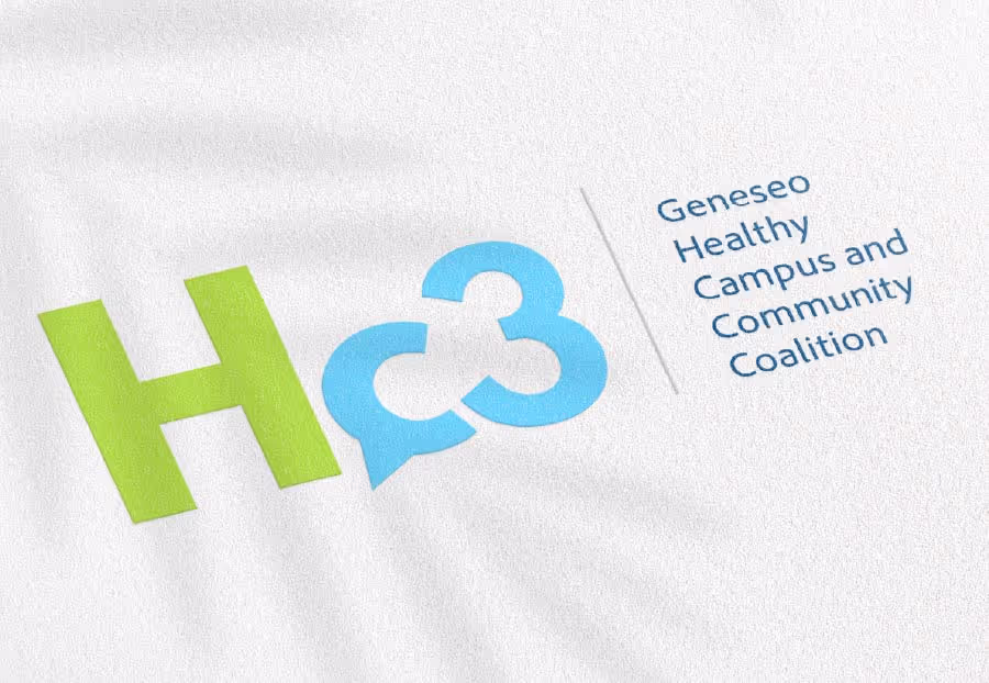 The logo for Geneseo Healthy Campus and Community Coalition, featuring a green 'H' and a blue 'c3' where the 'c' is shaped like a speech bubble, alongside the full blue text of the coalition name, all displayed on a white textured background.